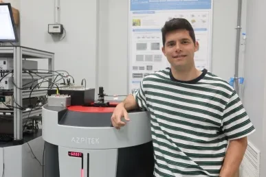 Manuel Suarez close to a PPMS at nanoGUNE 